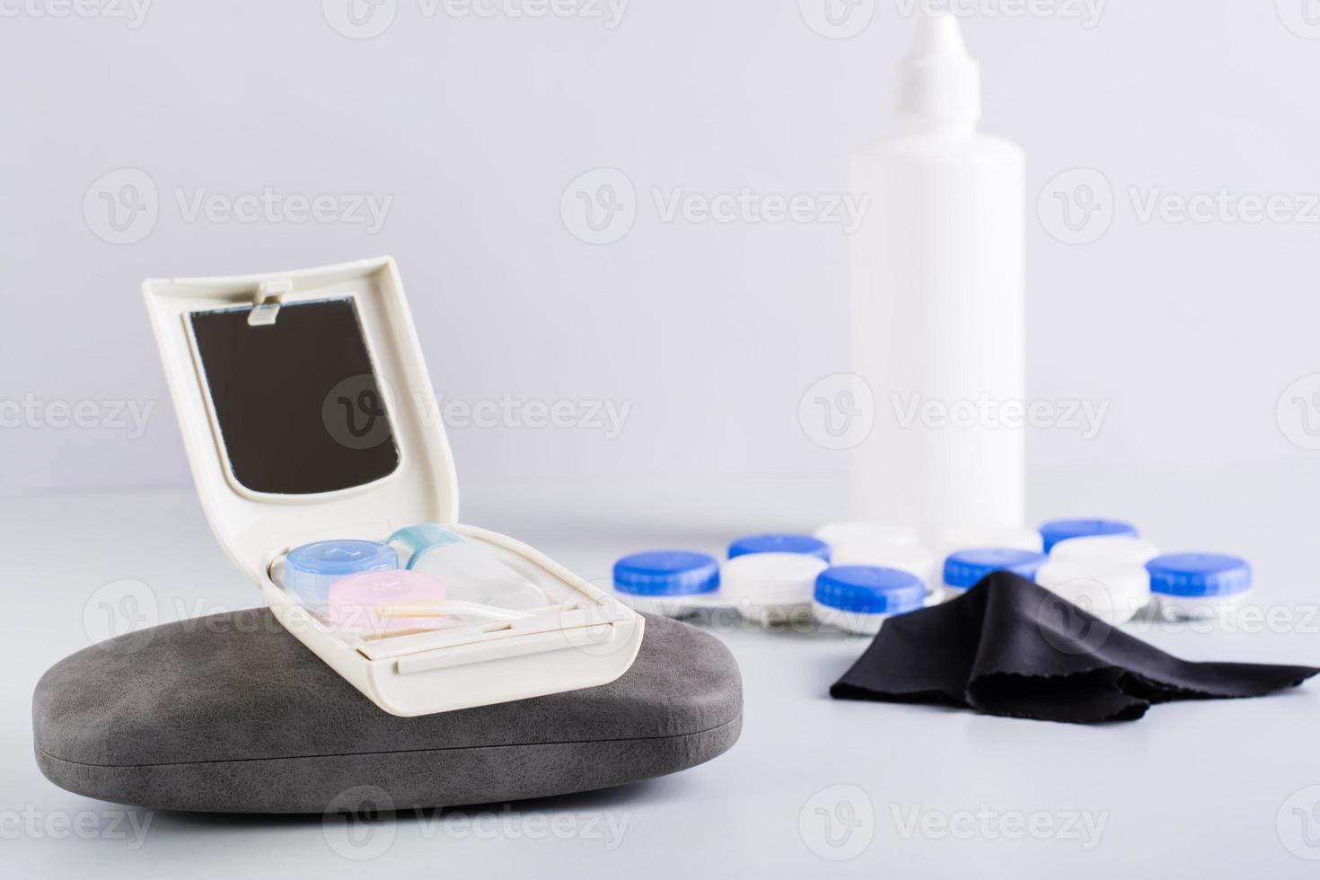 Travel set for storing contact lenses on a case for glasses. Alternative for vision correction photo