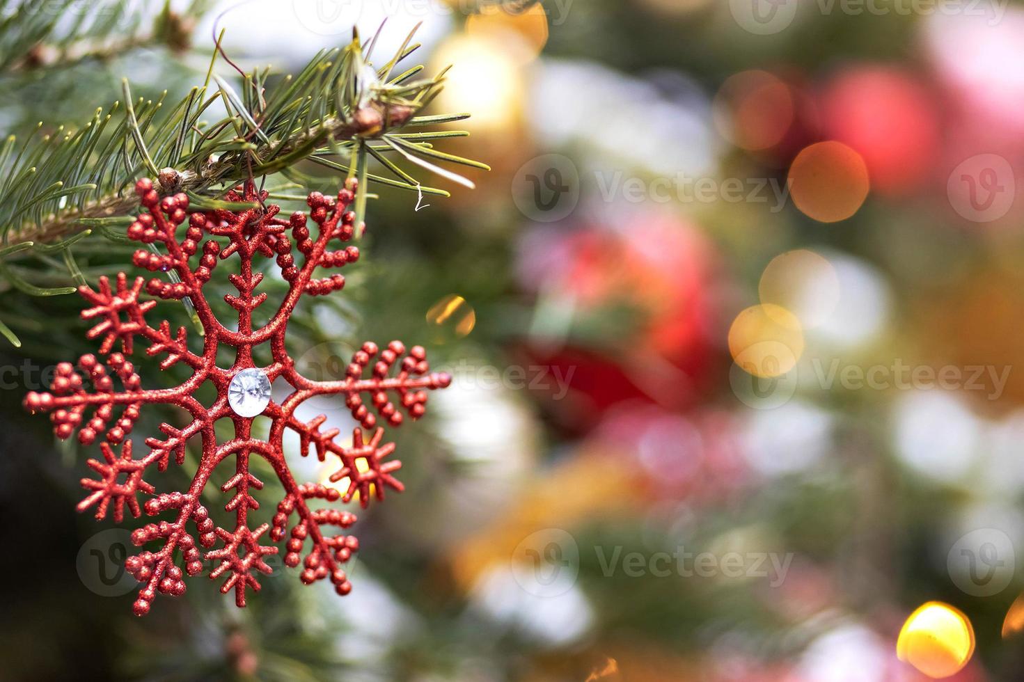 Christmas background of a Christmas tree decorated with Christmas toys. Winter holidays. New Year. photo