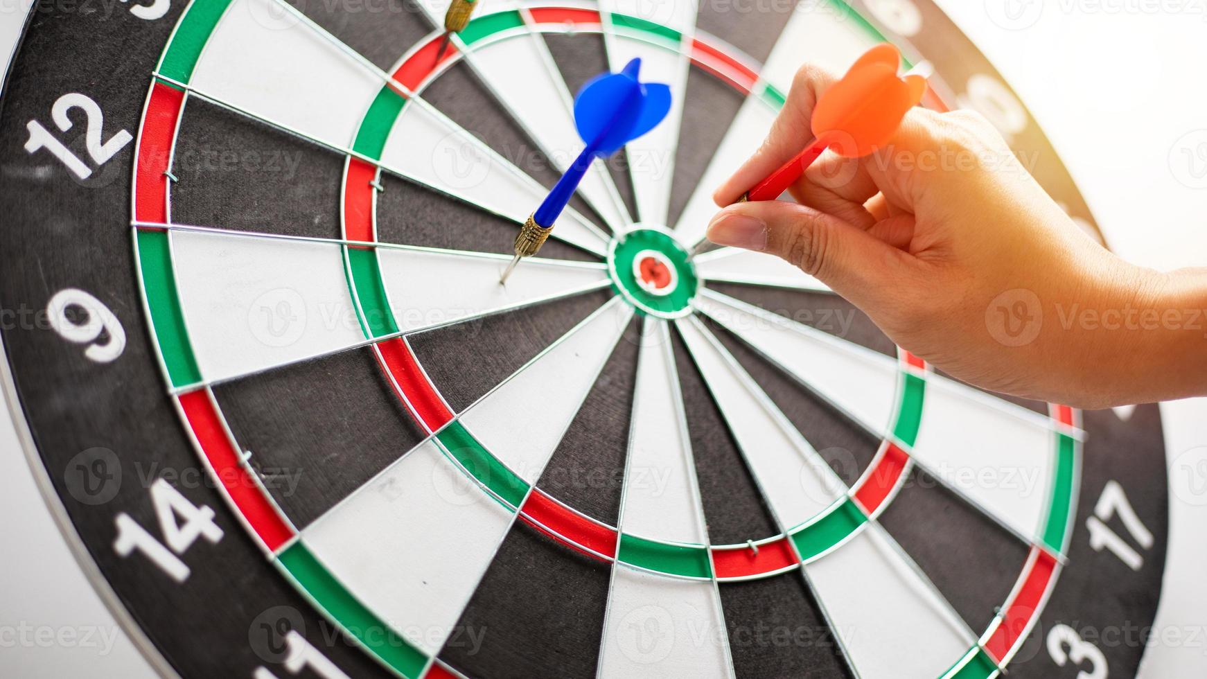 Hand business put a dart hit on the target,Goal target concept photo