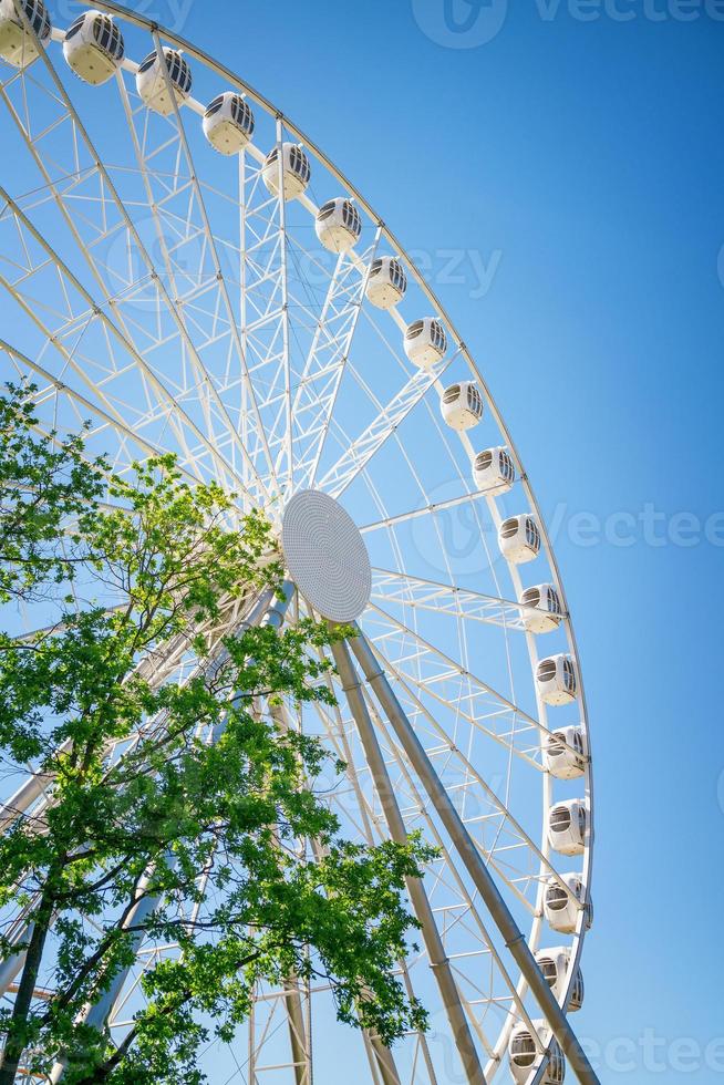Ferris wheel against the blue sky closeup photo