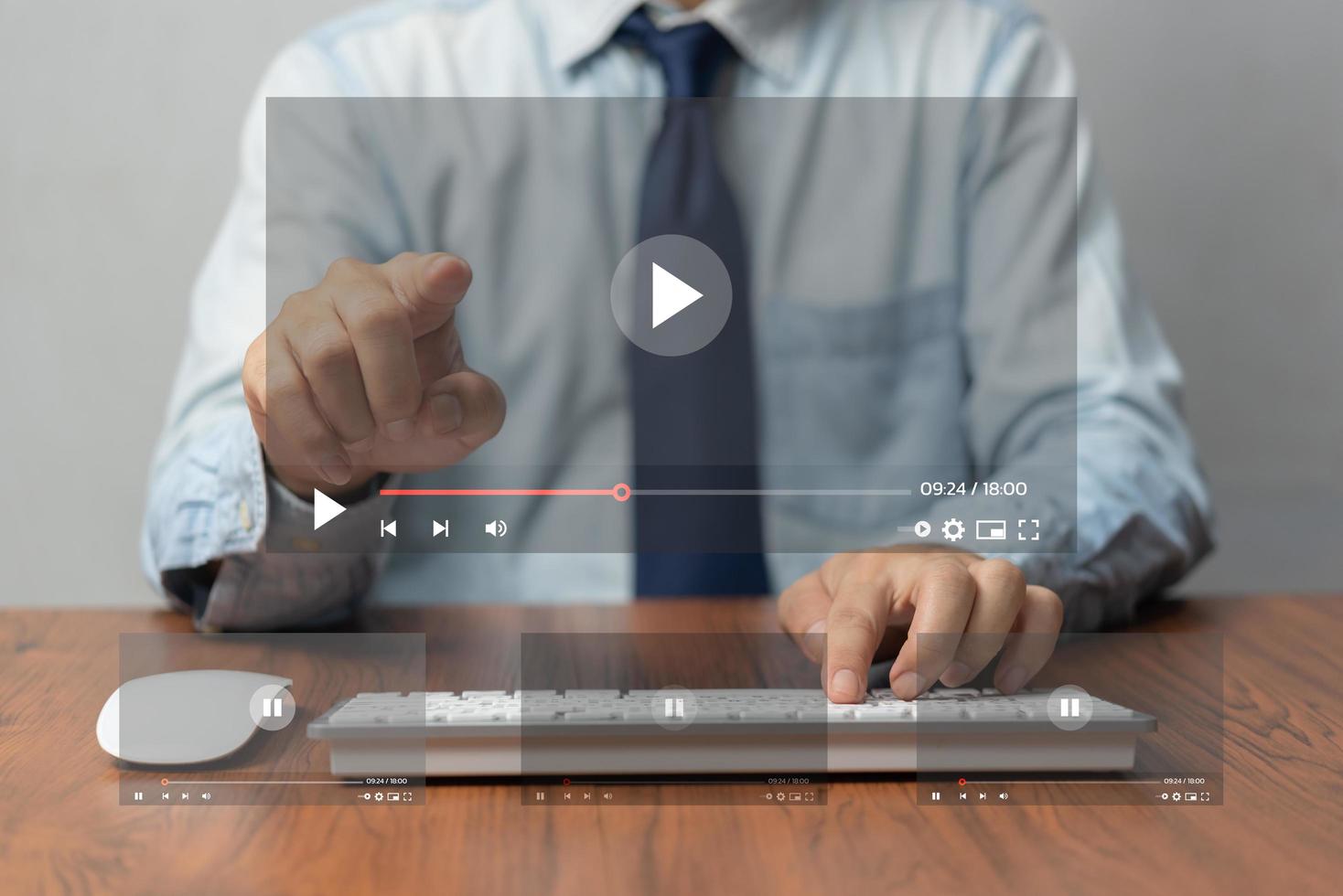 Businessman hands using mouse and keyboard computer for streaming online on virtual screen, watching video on internet. photo