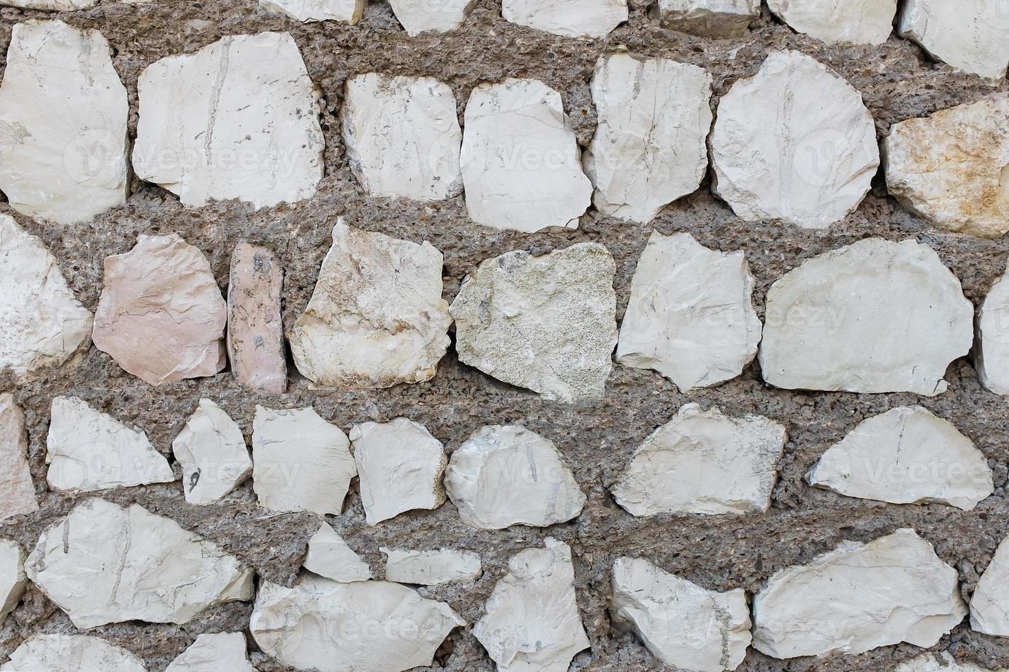 Background of natural old stone brick of an old castle, hedge. In photo