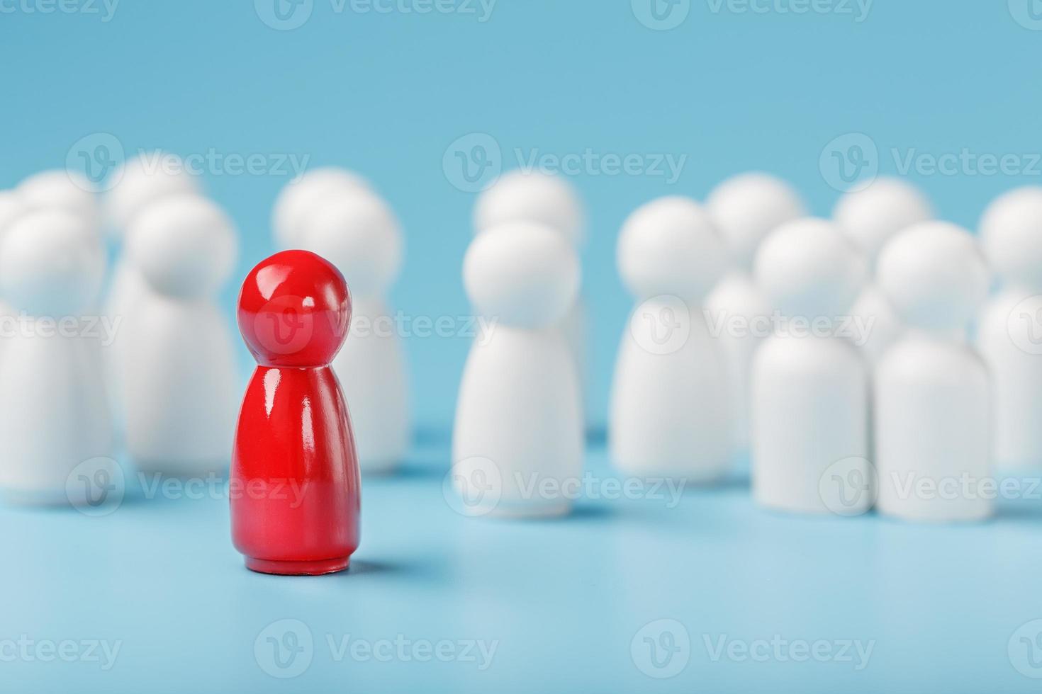 The leader in red leads a group of white employees to victory, HR, Staff recruitment. The concept of leadership. photo