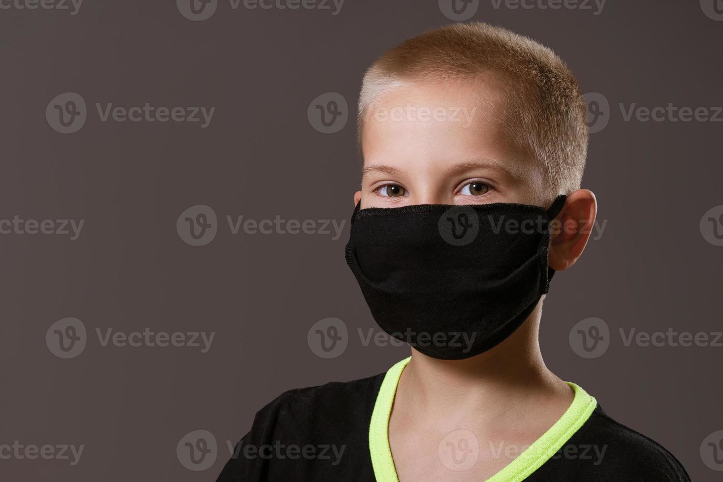 portrait of a guy in a black protective mask on the background photo