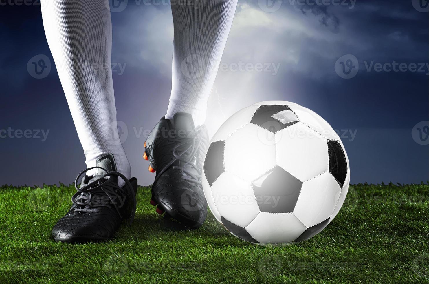 Football. Soccer. Soccer player dribbling with ball photo