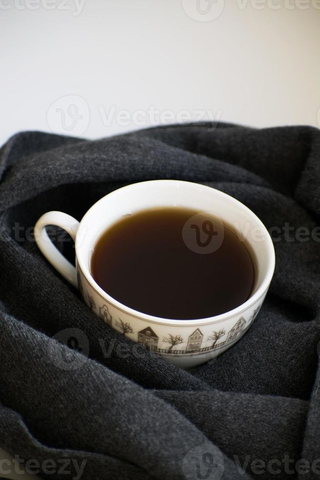 Cozy soft gray scarf with a cup of coffee photo