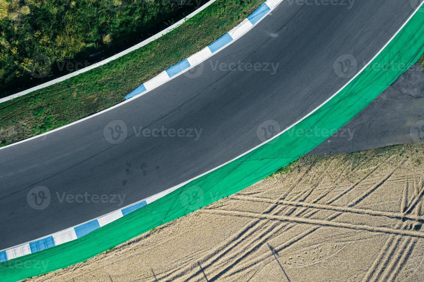 Aerial top down drone view of a racing track with tight turns and hairpins photo