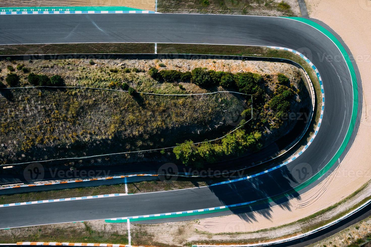 Aerial top down drone view of a racing track with tight turns and hairpins photo