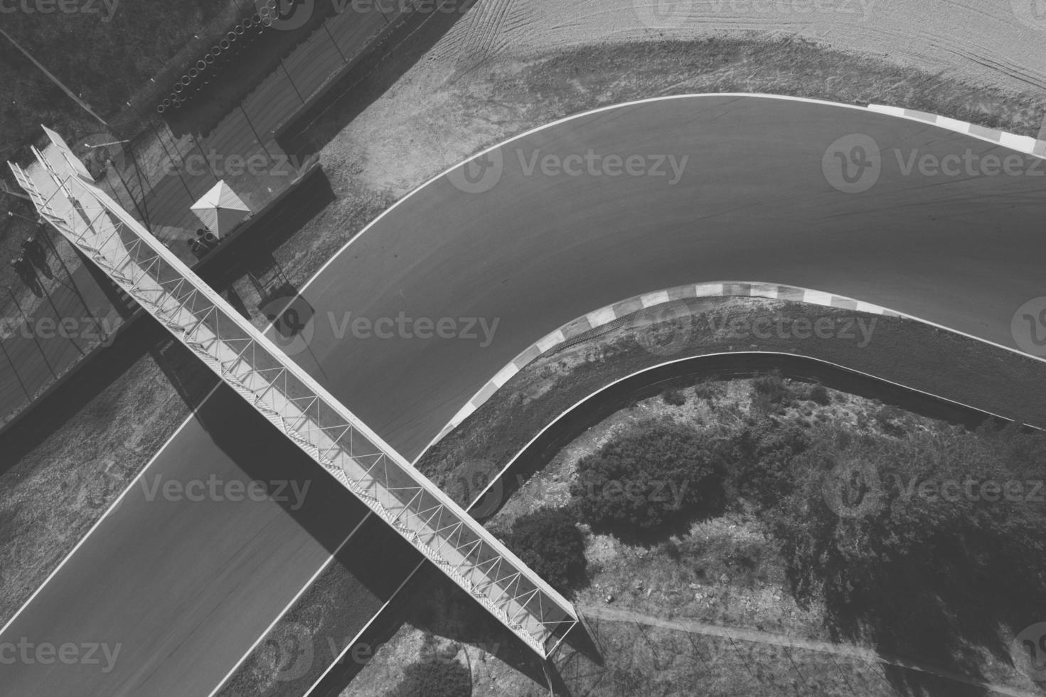 Aerial top down drone view of a racing track with tight turns and hairpins photo