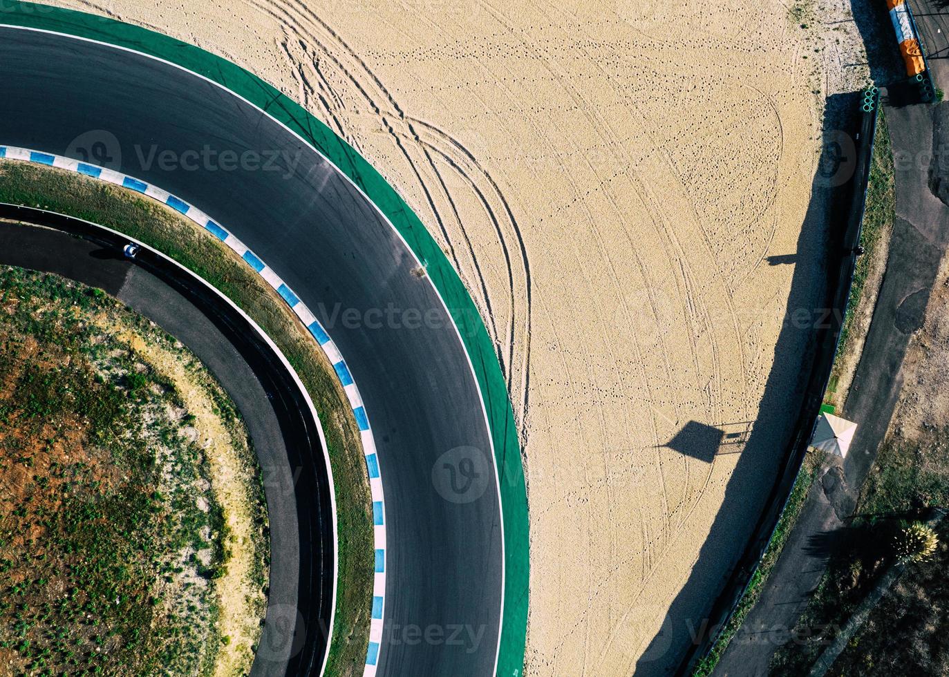 Aerial top down drone view of a racing track with tight turns and hairpins photo