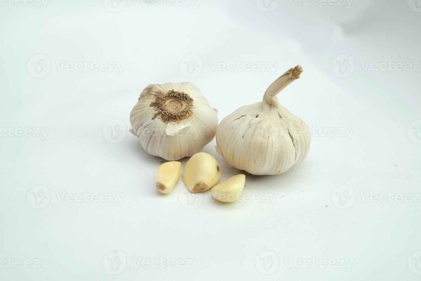 Garlic clove and bulb isolated on white background photo