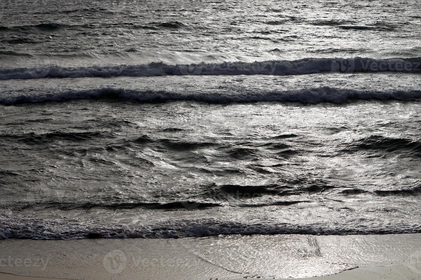 The color of the water in the mediterranean sea in shallow water photo