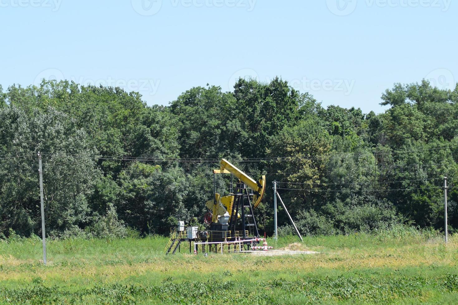 Pumping unit as the oil pump installed on a well photo