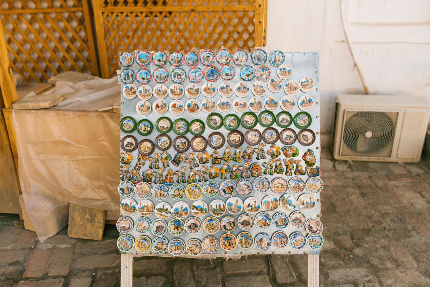 Bukhara, Uzbekistan. December 2021. Showcase with souvenir magnets photo
