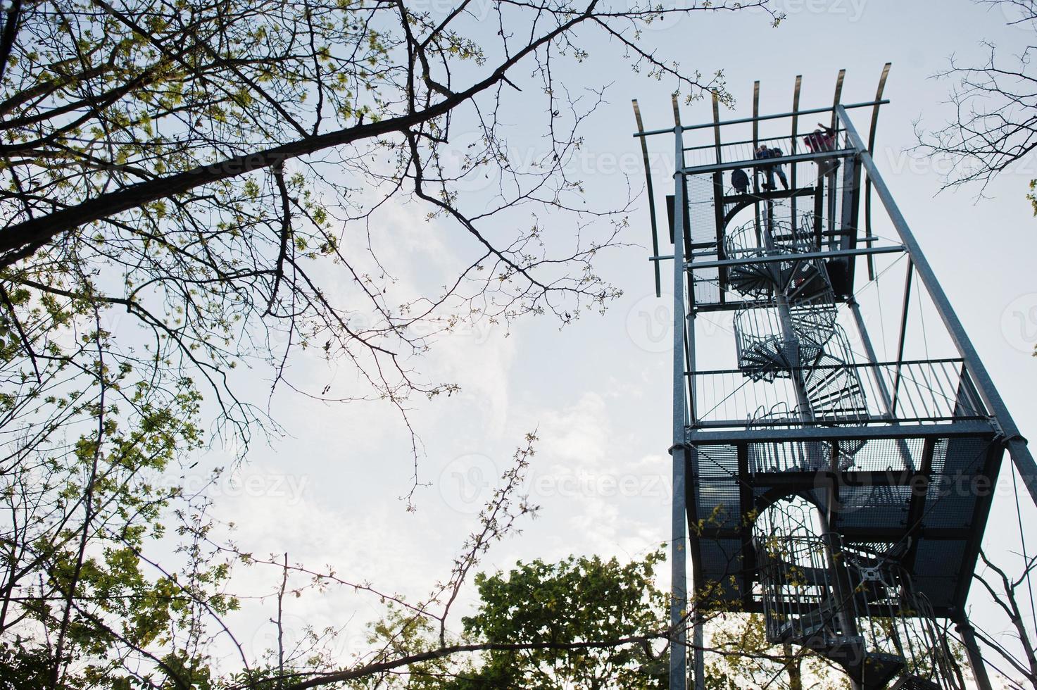 A viewing tower at Brno, Czech Republic. Watchtower during sunset with trees. photo