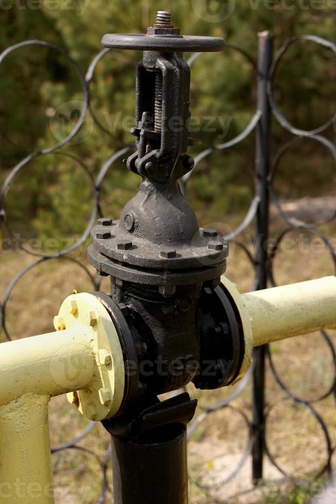 Yellow gas pipes and valves outdoors. gas equipment. Copy space for text. High quality photo