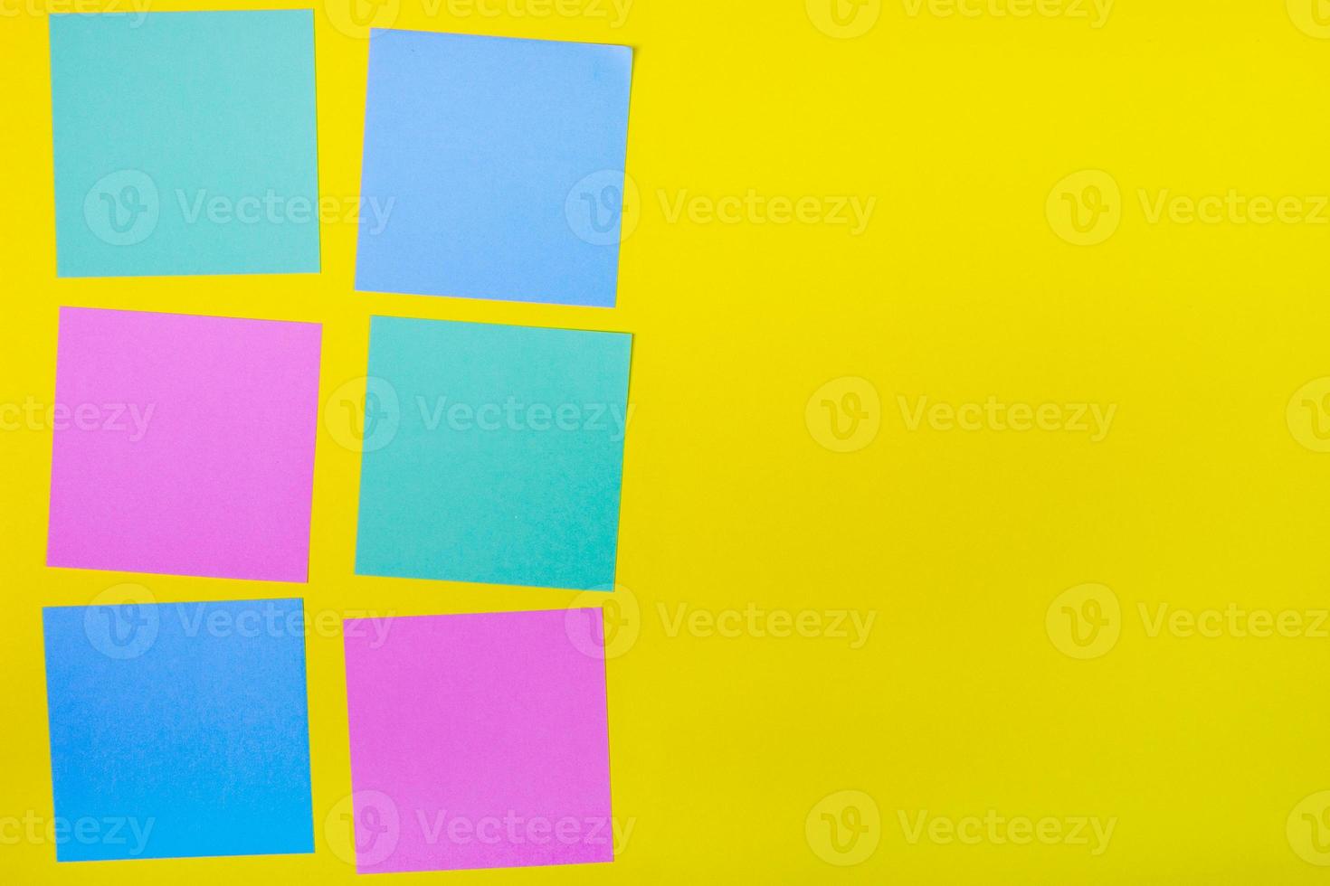 Colorful documents with copy space on a colored background. View from above. For notes and ideas. photo