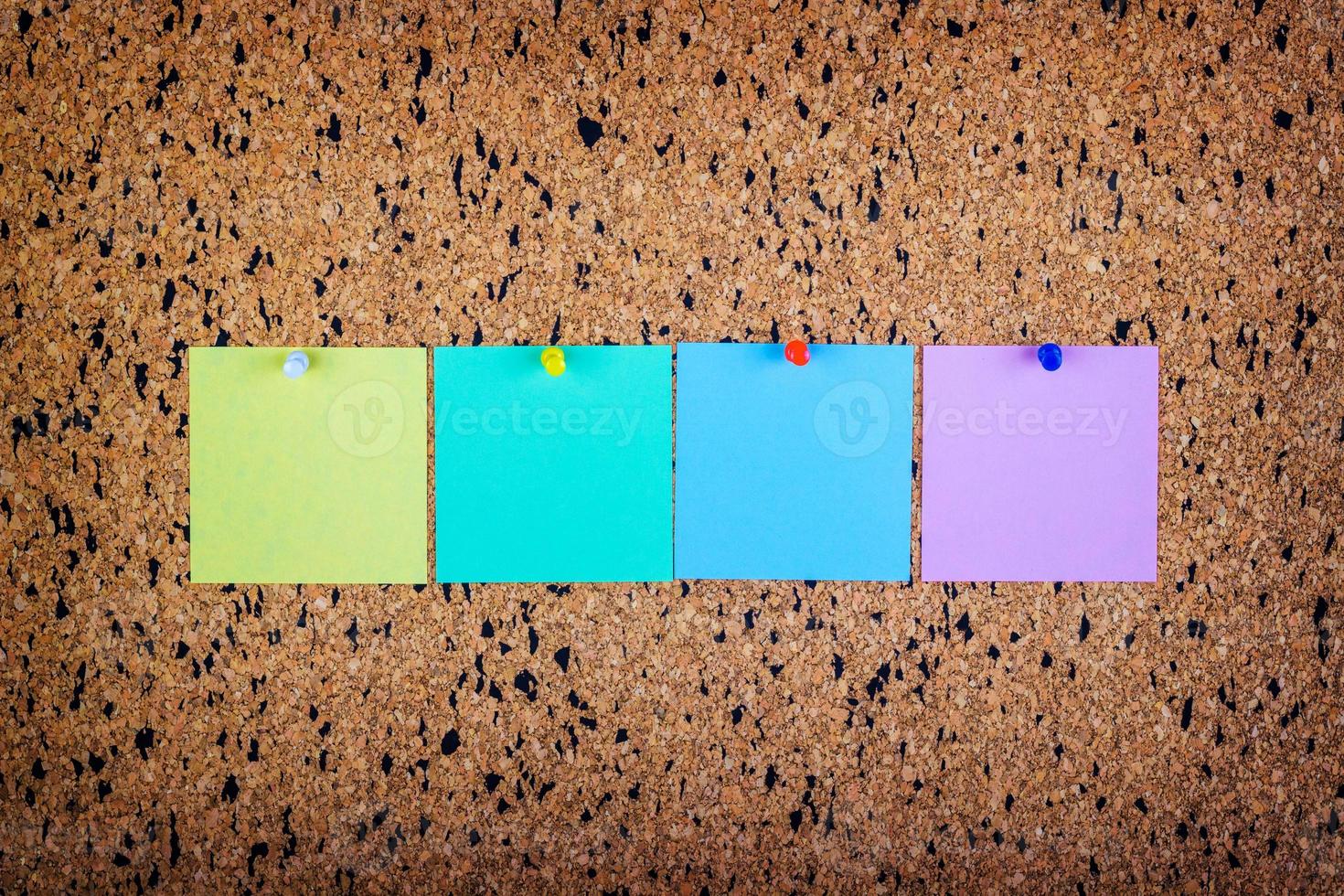 sticky note on cork board, empty space for text photo