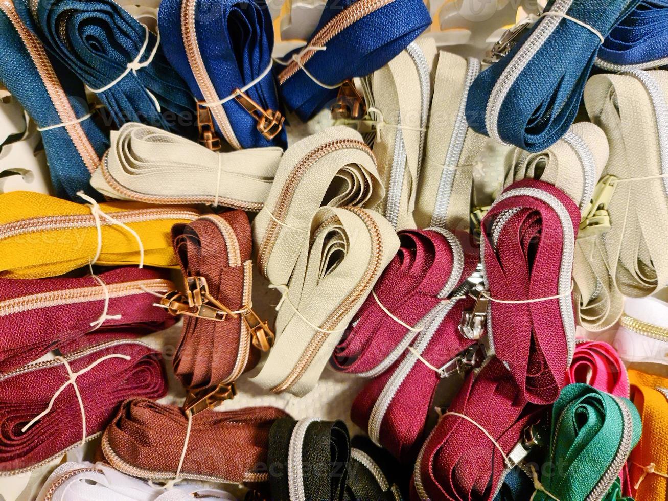 Many zips in different colours. photo