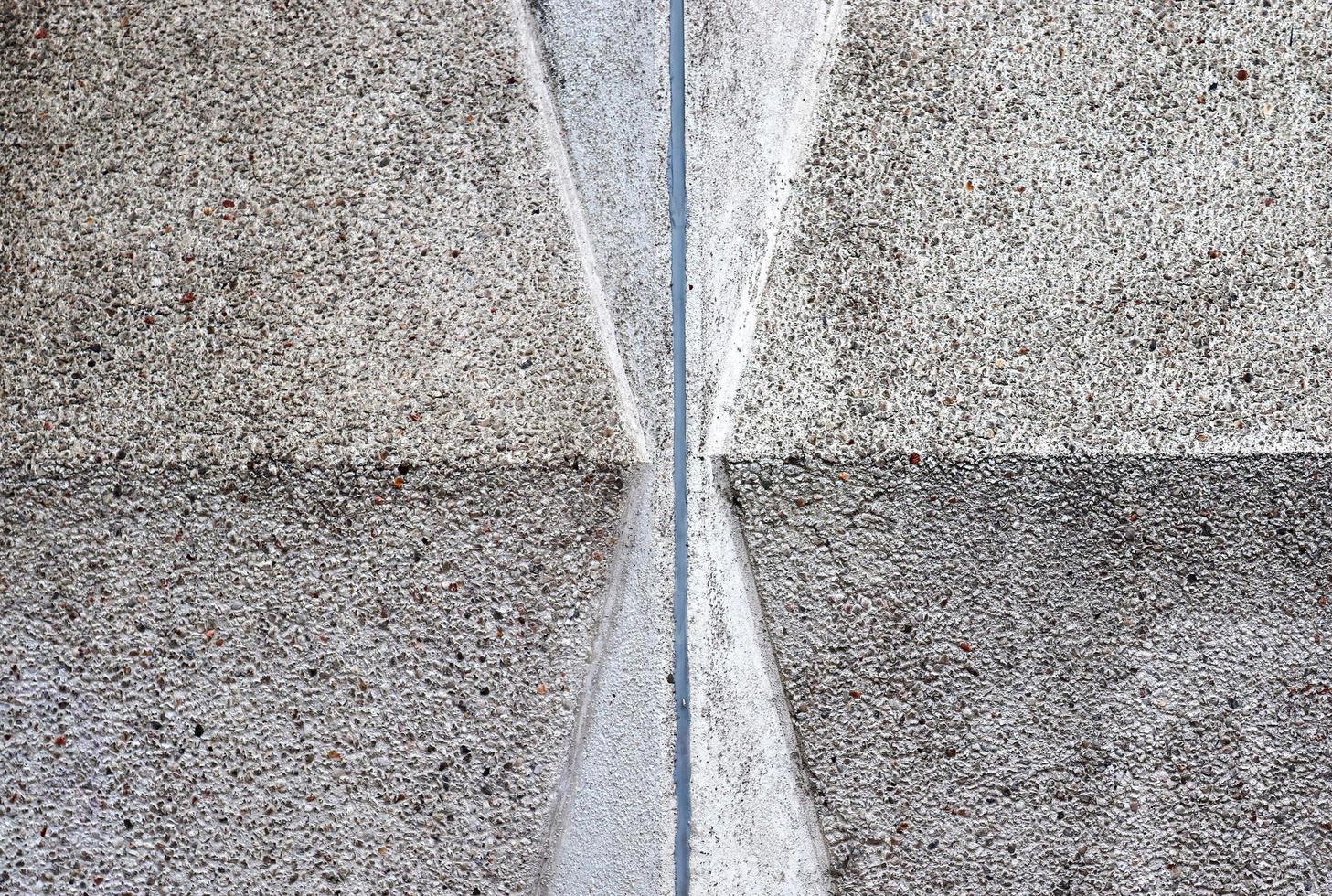 Detailed view on aged concrete walls with cracks and a lot of structure in high resolution photo
