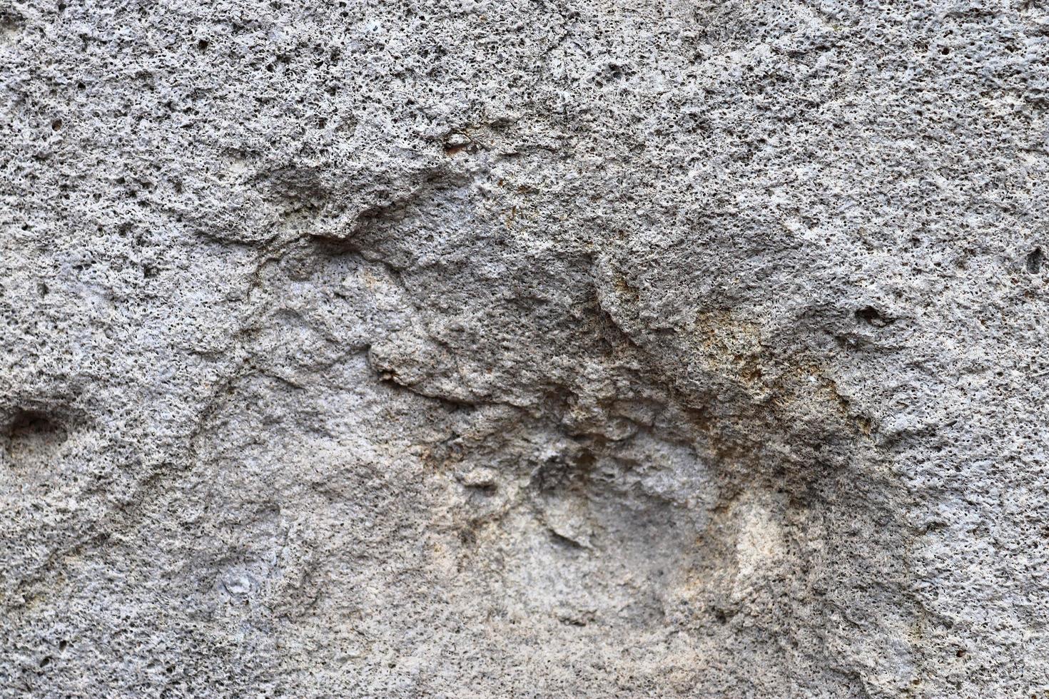 Detailed view on aged concrete walls with cracks and a lot of structure in high resolution photo