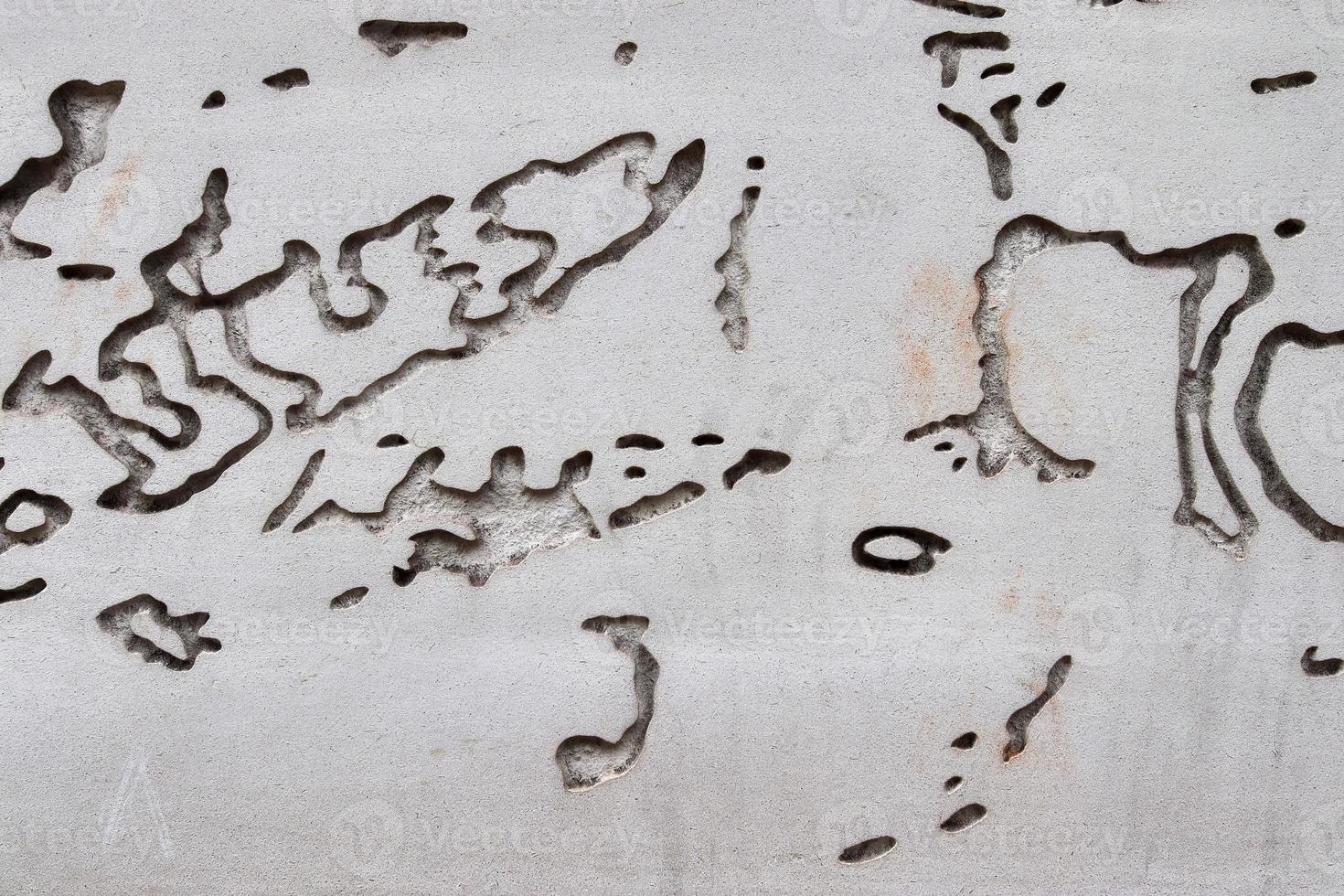 Detailed view on aged concrete walls with cracks and a lot of structure in high resolution photo