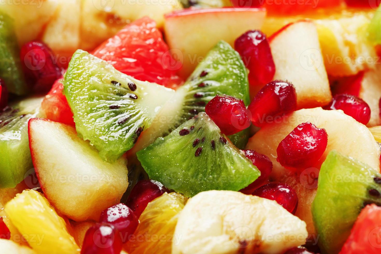 Fruit salad close-up in full screen, as a background. photo