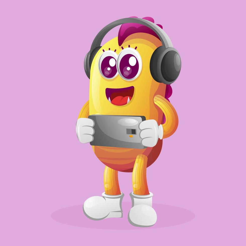Cute yellow monster playing game mobile, wearing headphones vector