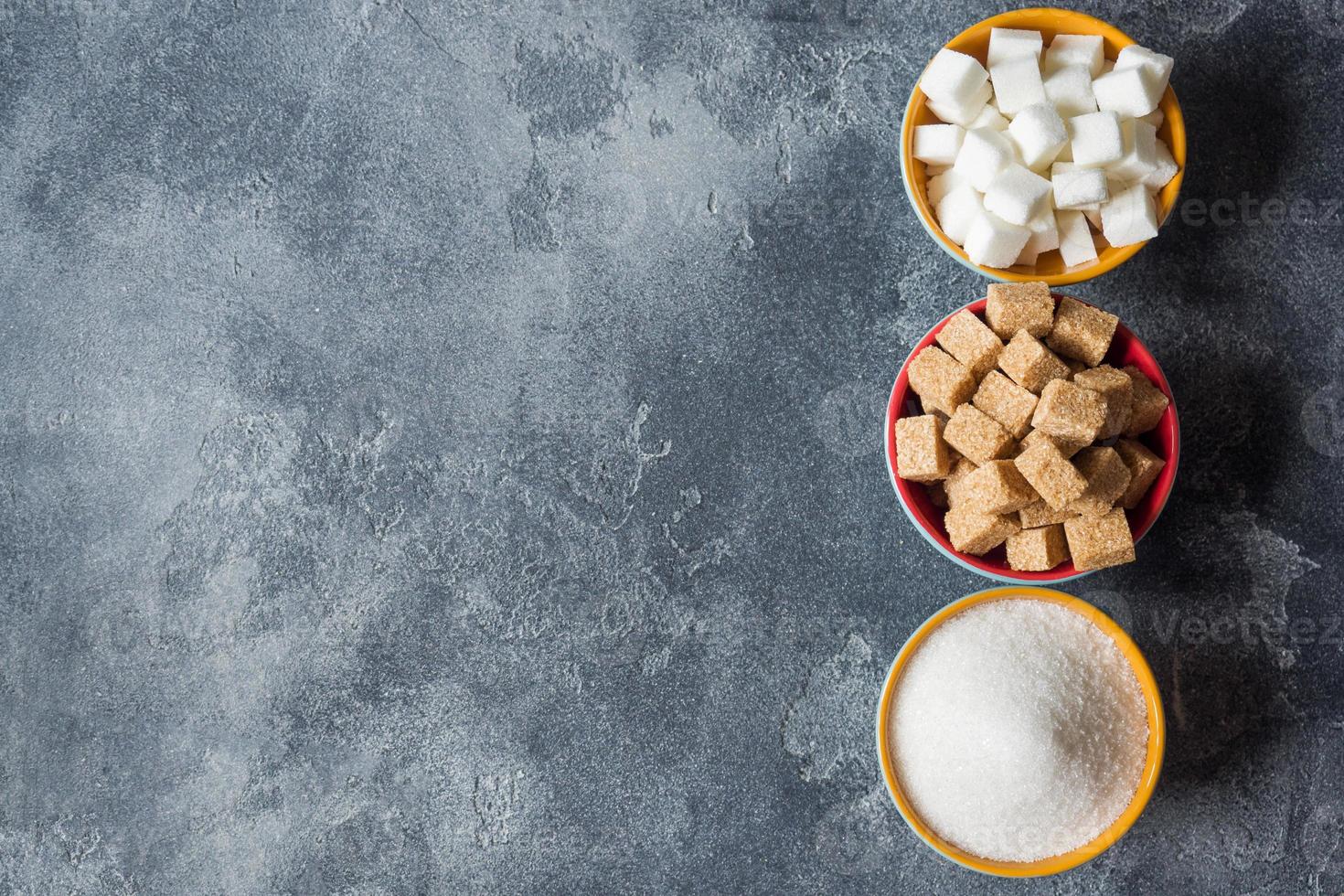 White sugar and brown sugar cane cube on the dark background of the brutal Selective focus photo