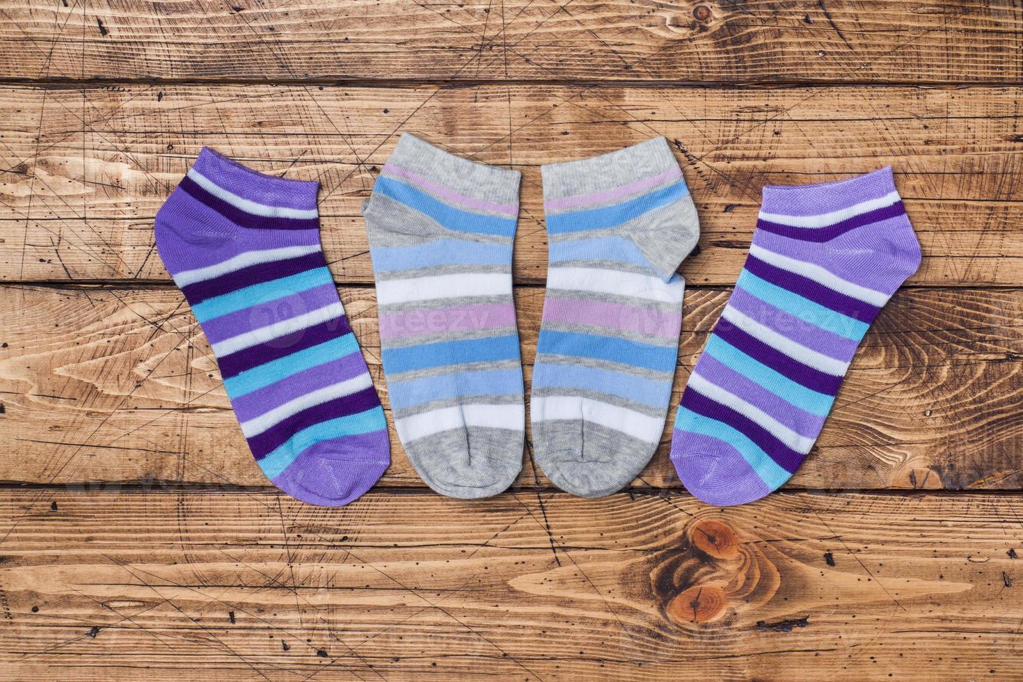 Socks on wooden background. color socks short women's under shoes photo