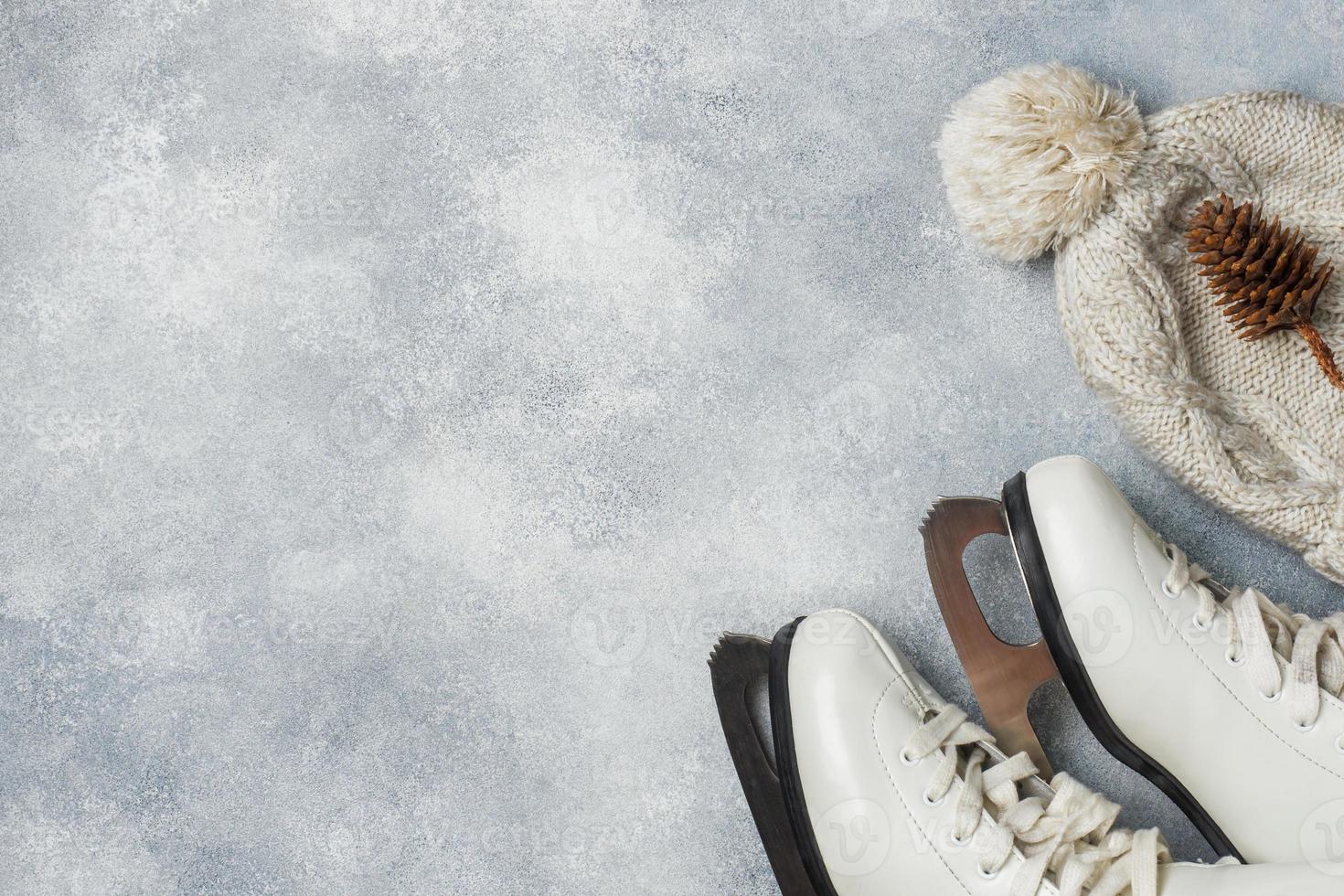 Winter vacation concept. Warm clothes, Cup of hot tea with fragrant spices on grey background. Copy space photo