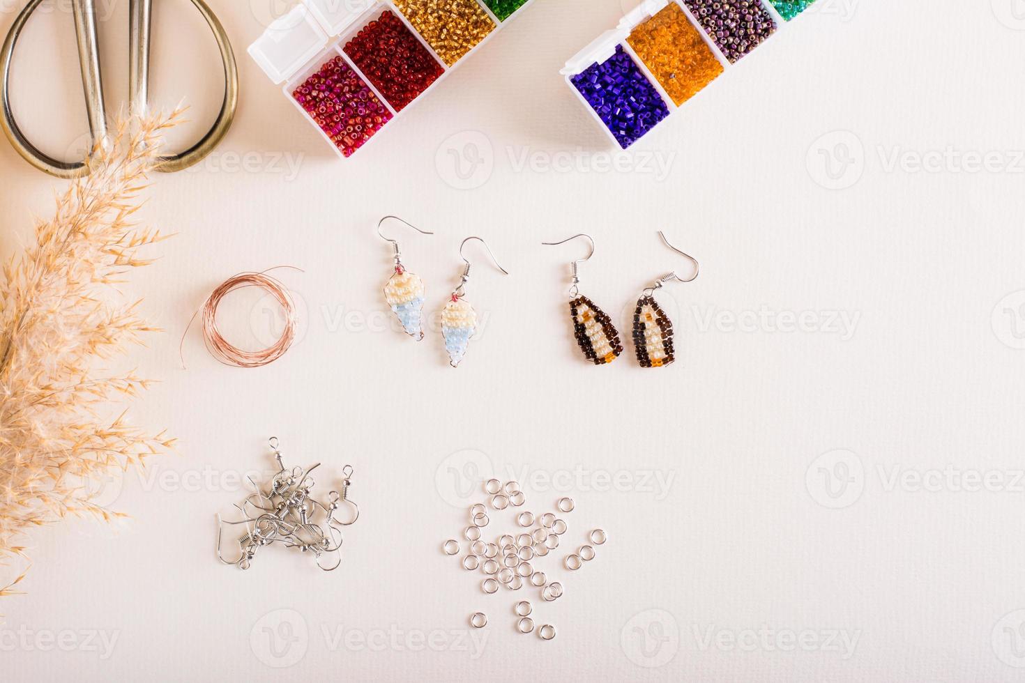 Working tools, beads and accessories for making jewelry. Needlework and handmade. Top view photo