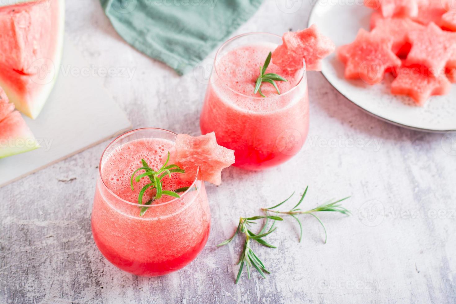 Cold watermelon drink in glasses on the table. Summer refreshing cocktails photo