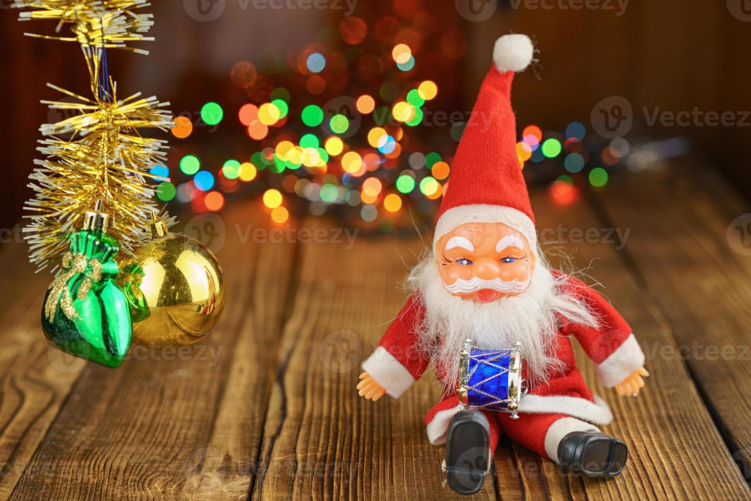 Santa Claus on wooden background beautiful bokeh photo