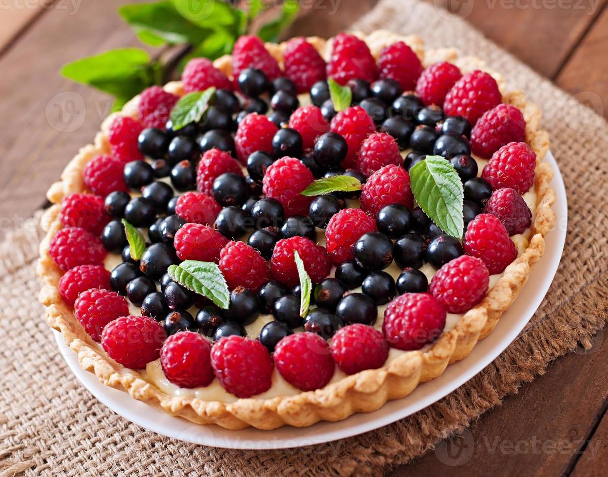 Tart with berries and custard photo