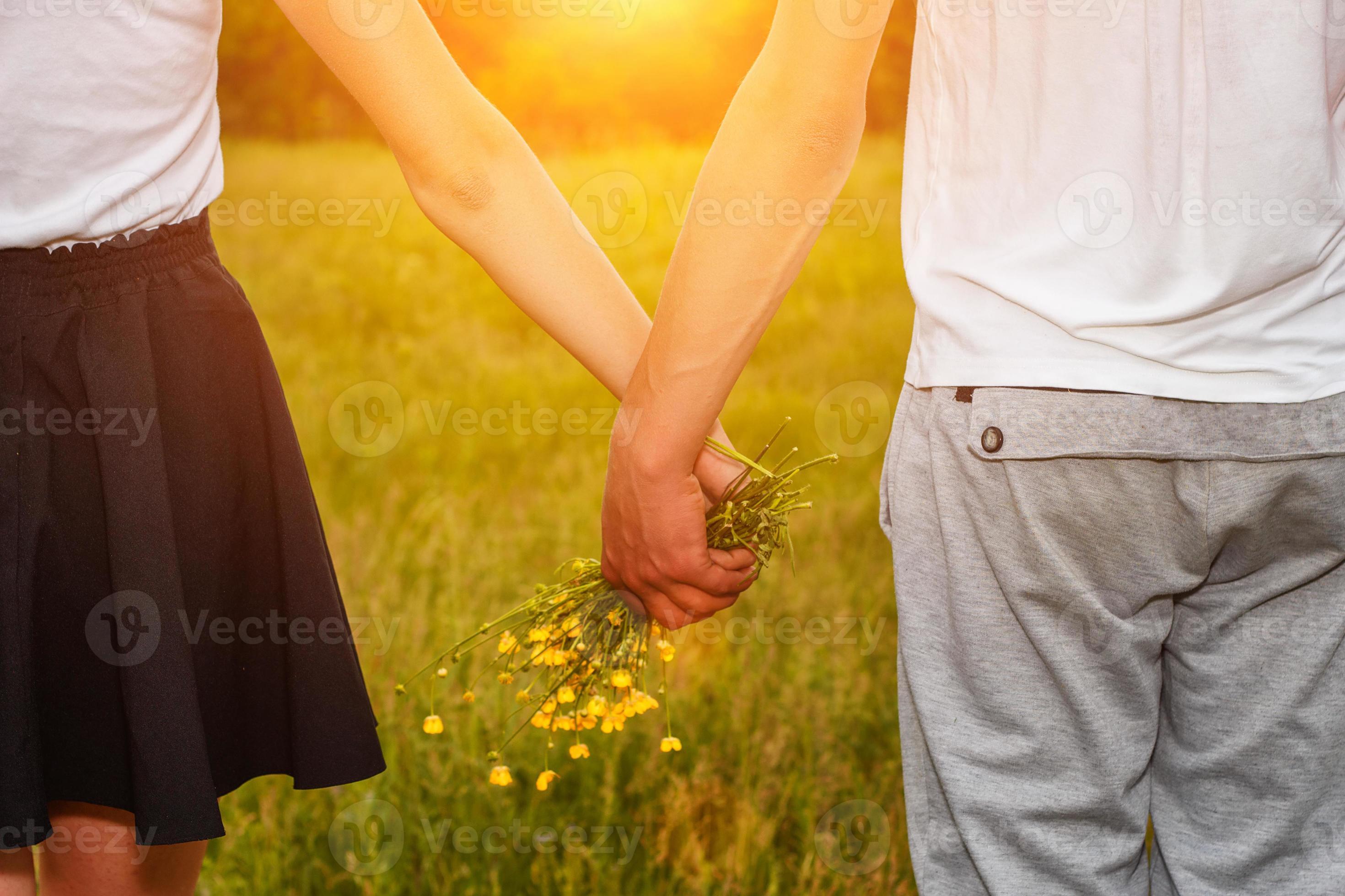 girlfriend and boyfriend holding hands