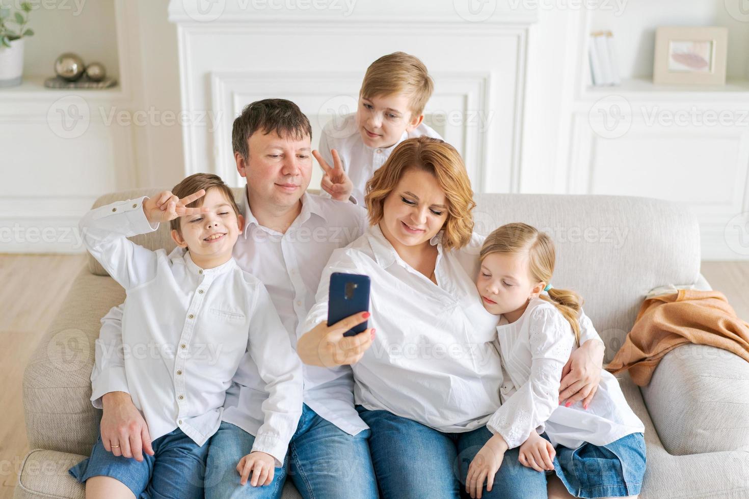 Portrait caucasian cheerful family happy parents and little children taking photo