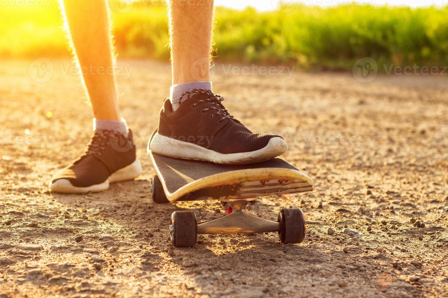 skateboarding on the road at sunset , summer entertainment photo