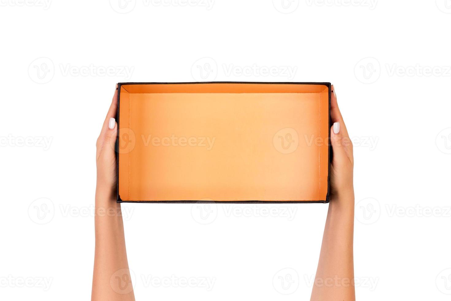 A woman hands hold a white empty paper box container, tidy and top view isolated white photo