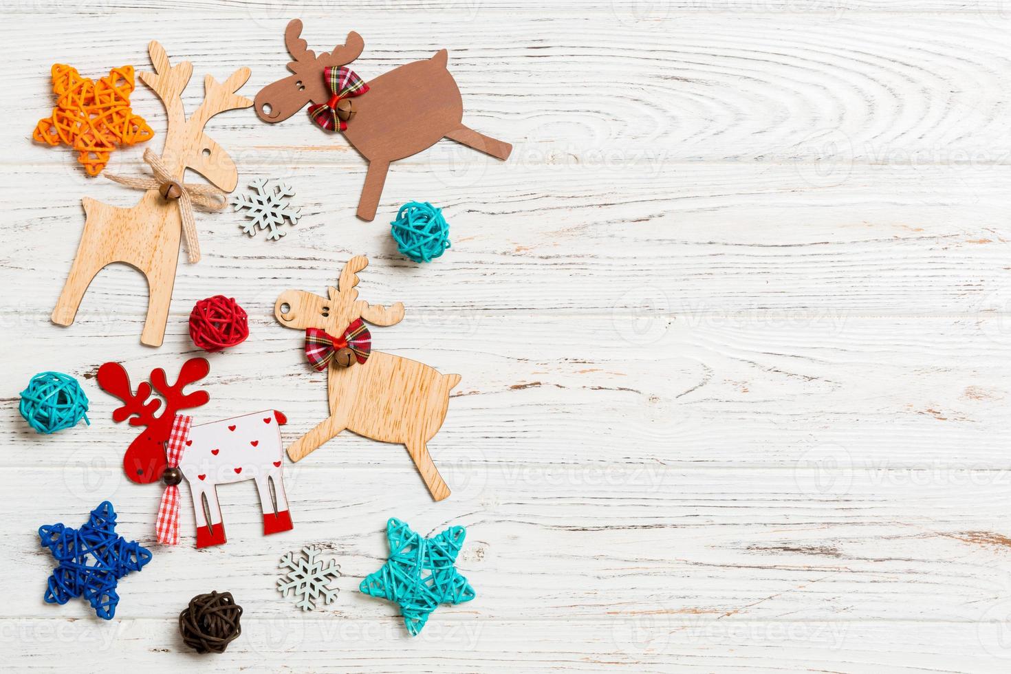 Top view of Christmas decorations and toys on wooden background. Copy space. Empty place for your design. New Year concept photo