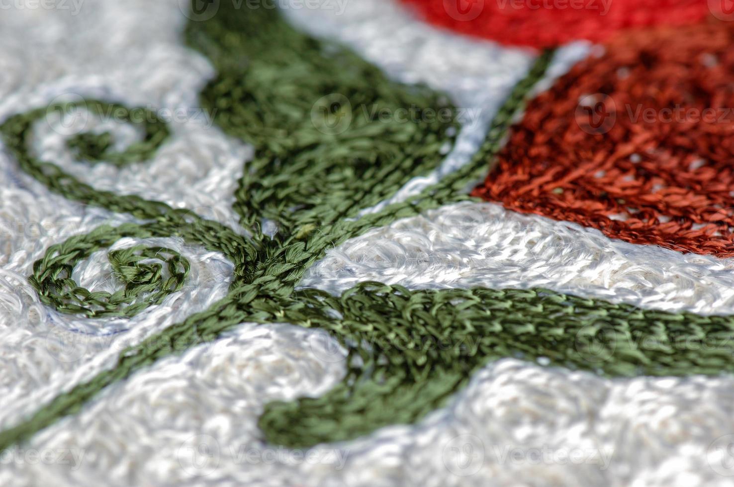 A closeup shot of national ornaments and patterns of Central Asia on a piece of cloth photo