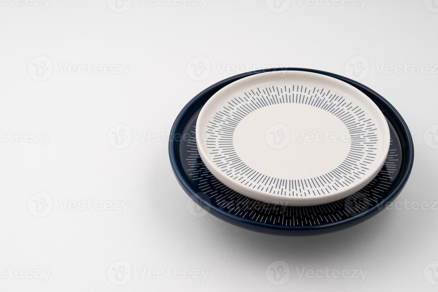 A set of blue and white luxury ceramic kitchen utensils on a white background photo