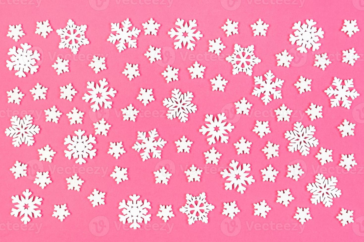 Top view of winter ornament made of white snowflakes on colorful background. Happy New Year concept with copy space photo