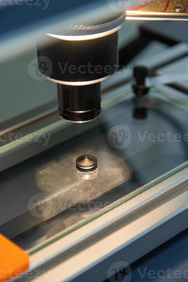 A closeup of the production and quality control of the internal parts of medical syringes photo
