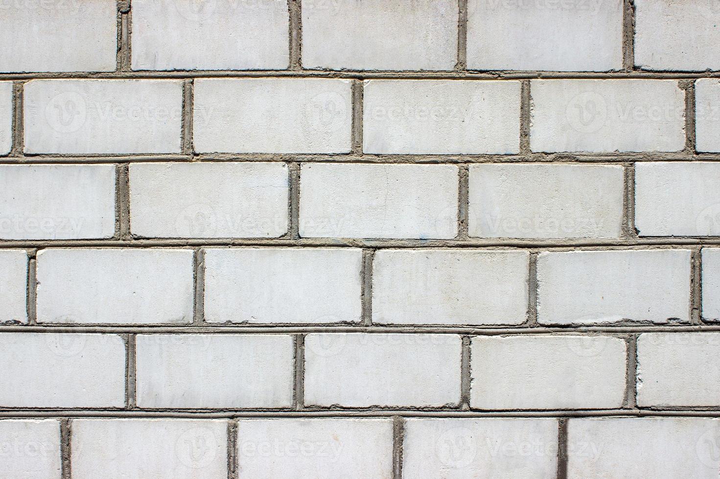 Marble wall textured background detail of a stone in the city, facade decorated photo