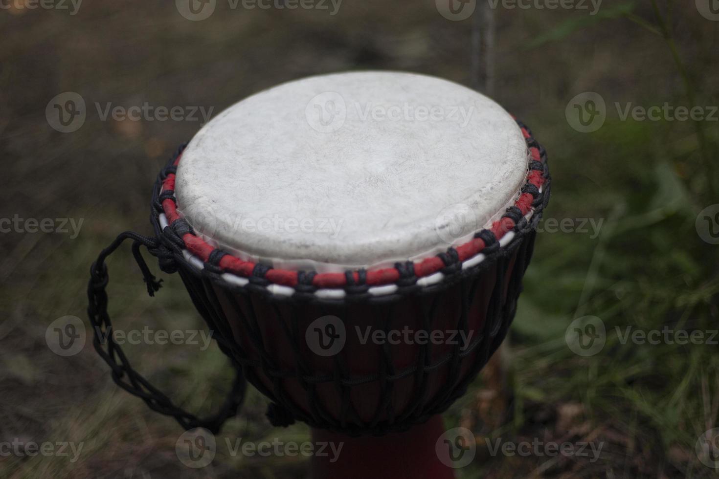 African drum. Membrane of percussion musical instrument. Wooden drum in