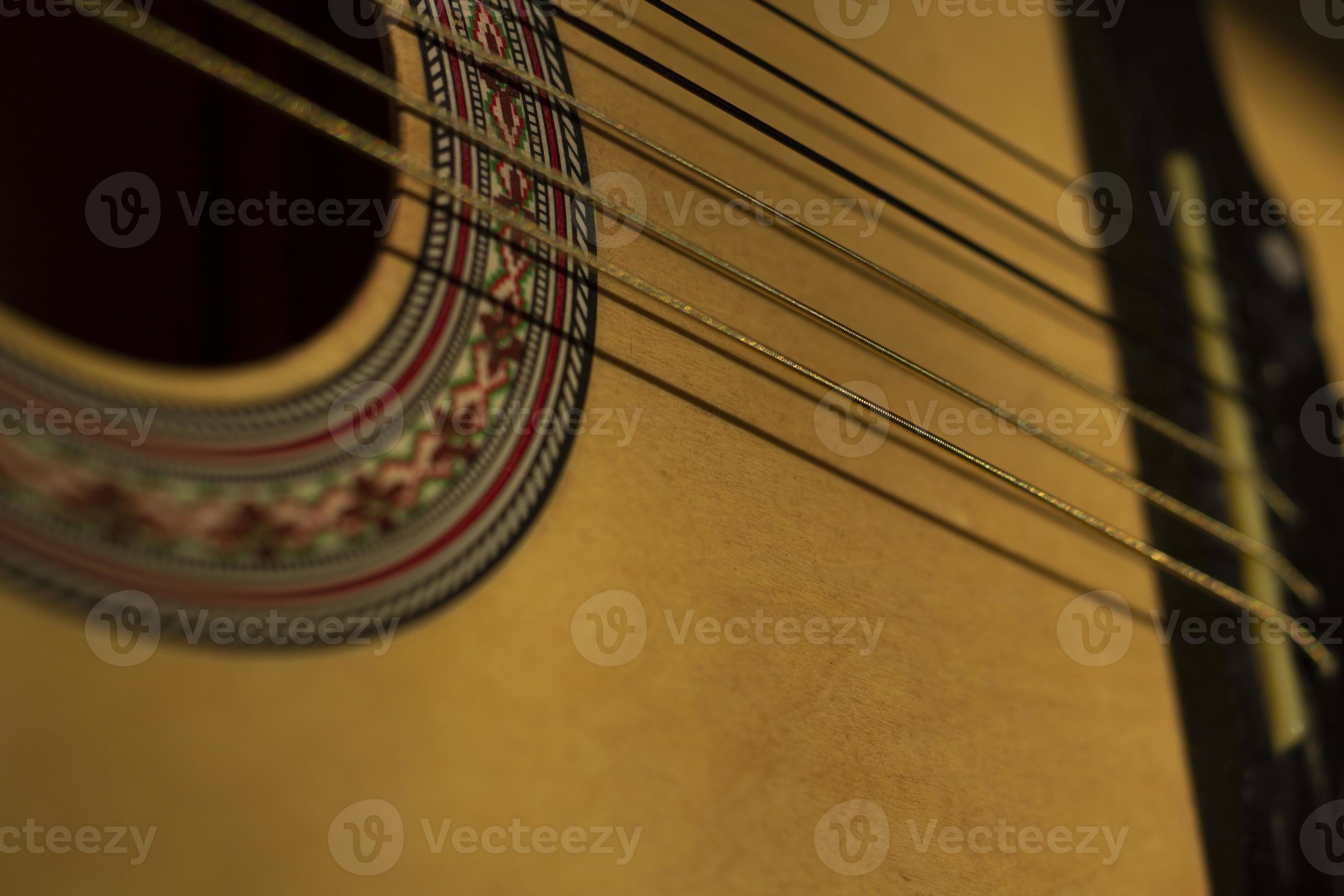 Strings on guitar. Details of music. Acoustic instrument. Spanish