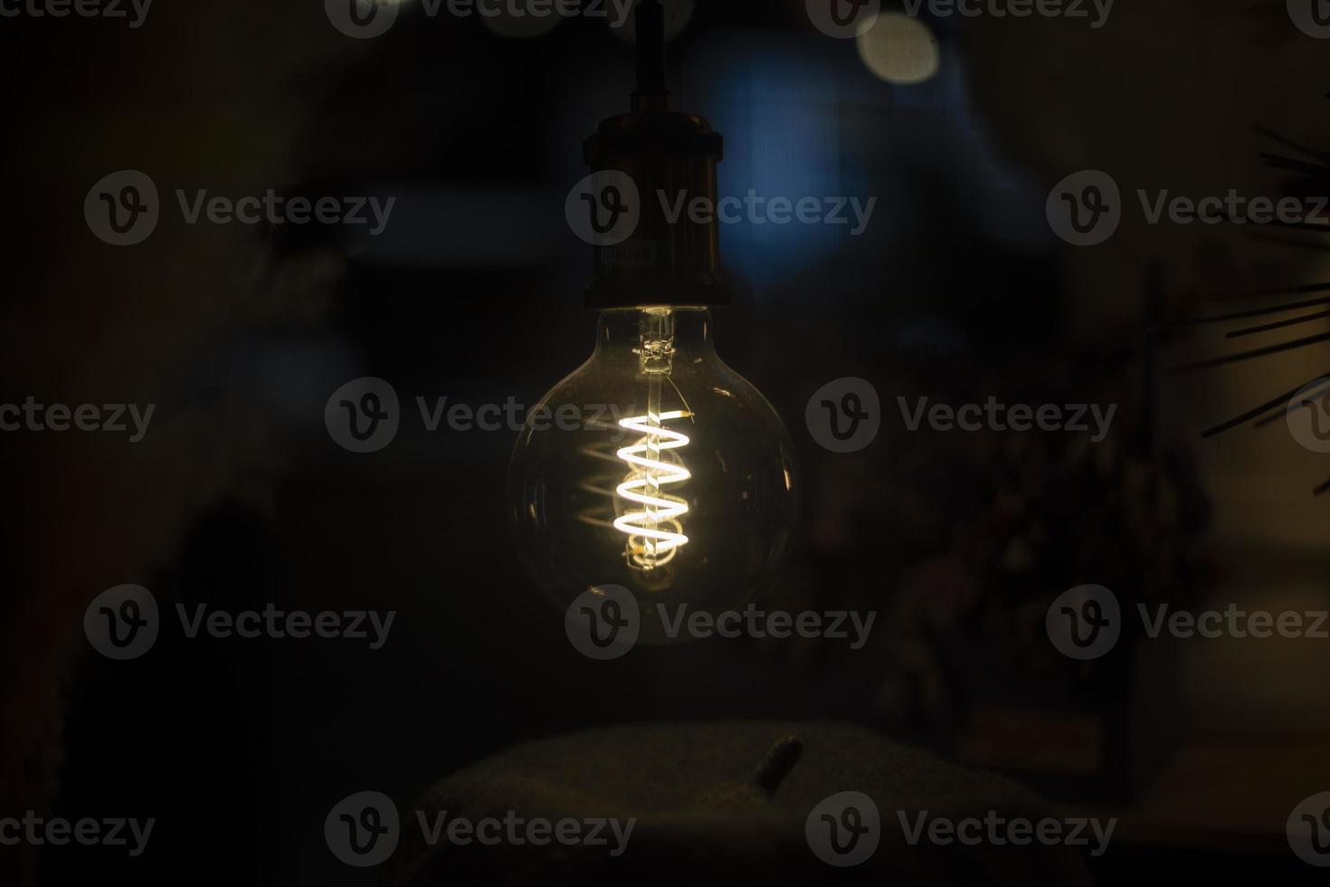 Retro incandescent lamp. Filament in glass. Interior details. 13185164