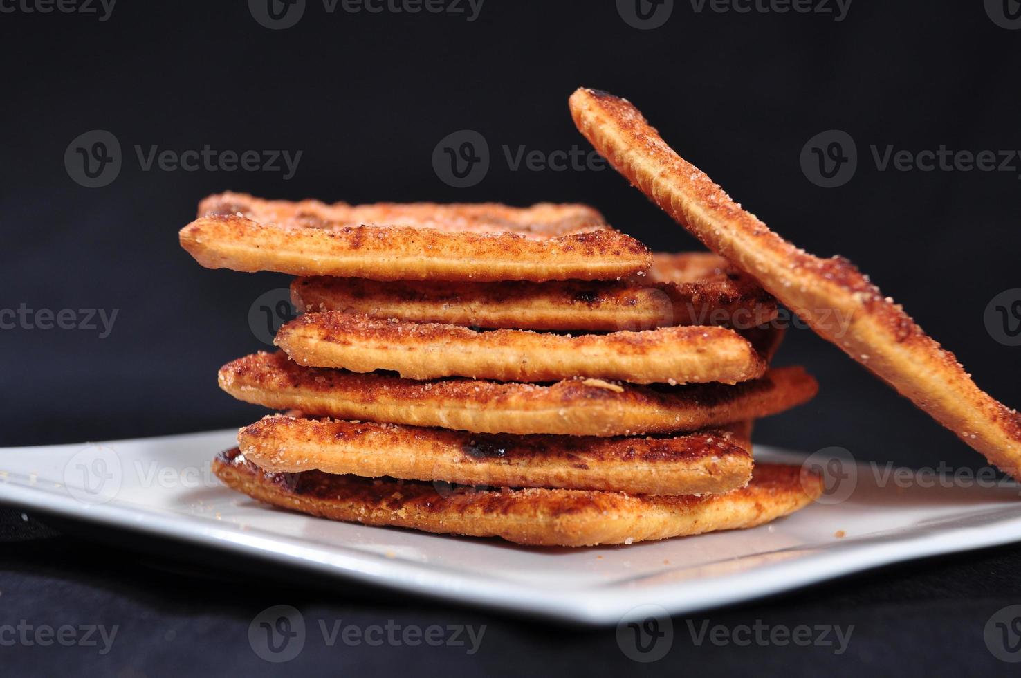 stack of cracker on the white plate photo