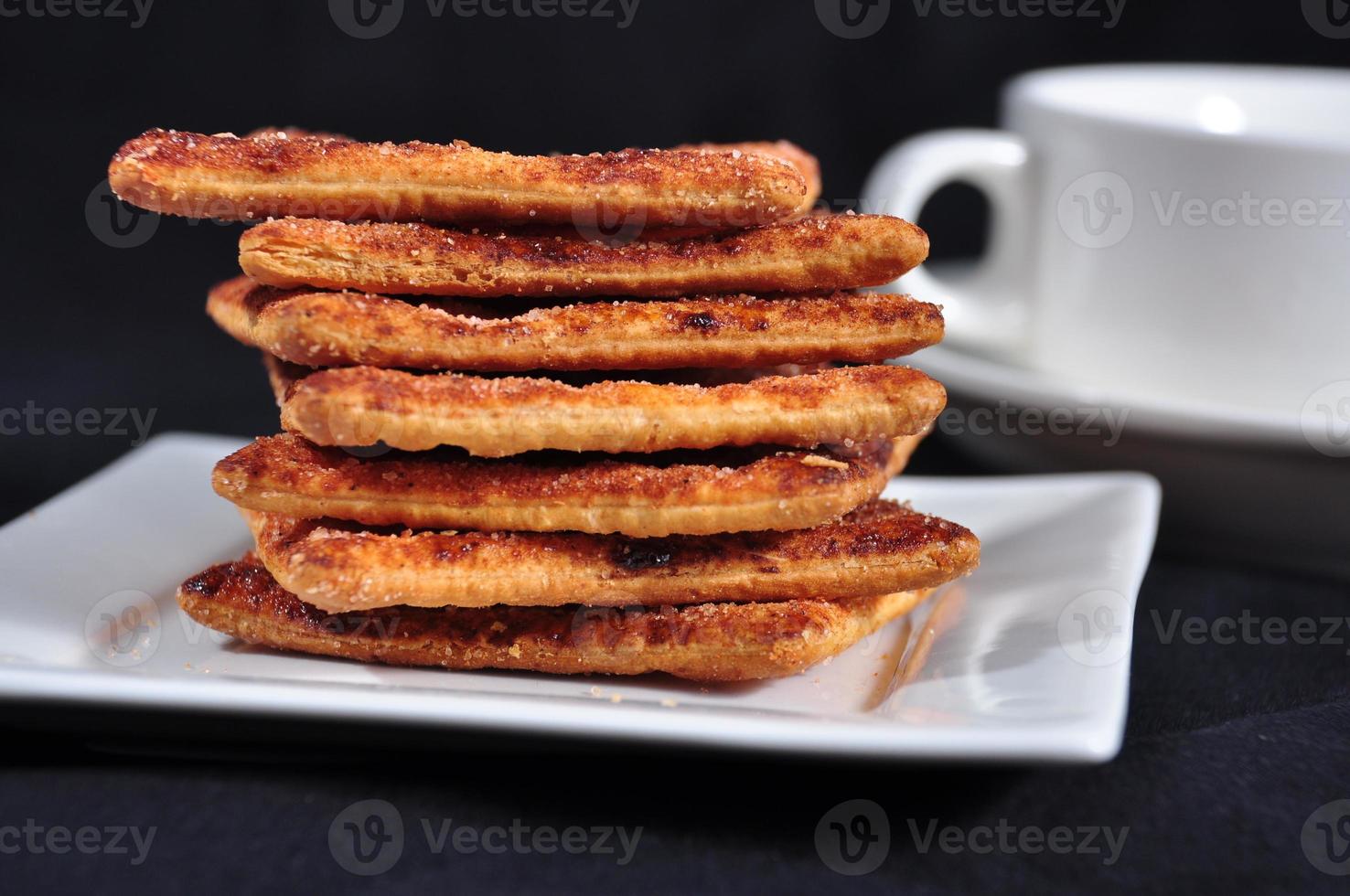 stack of cracker on the white plate photo